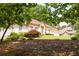 Charming home with a lush front yard, beautiful landscaping, and a convenient two-car garage at 427 Picketts Lake Dr, Acworth, GA 30101