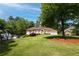 Inviting home with a lush green lawn, well-maintained landscaping, and a two-car garage at 427 Picketts Lake Dr, Acworth, GA 30101