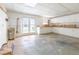 Spacious garage with ample storage, double doors to backyard, and work area at 427 Picketts Lake Dr, Acworth, GA 30101