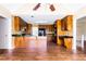 Spacious kitchen with hardwood floors, wood cabinets, granite counters, and stainless steel appliances at 427 Picketts Lake Dr, Acworth, GA 30101