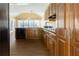 Kitchen featuring custom cabinets, stainless dishwasher, granite countertops, and a tile backsplash at 427 Picketts Lake Dr, Acworth, GA 30101