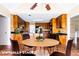 Bright eat-in kitchen featuring custom cabinets, granite countertops, stainless appliances, and hardwood floors at 427 Picketts Lake Dr, Acworth, GA 30101
