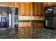 Updated kitchen featuring stainless appliances, custom cabinets, granite countertops, and a tile backsplash at 427 Picketts Lake Dr, Acworth, GA 30101