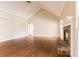 Bright living room features hardwood floors, vaulted ceilings, a stone fireplace and large windows at 427 Picketts Lake Dr, Acworth, GA 30101
