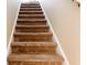 Carpeted stairs lead to the next level at 427 Picketts Lake Dr, Acworth, GA 30101
