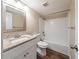 Bathroom featuring a shower-tub combo with a new vanity and wood flooring at 5810 Tree Line Ter, Lithonia, GA 30058