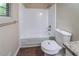 Clean bathroom features a shower and tub combination with white tile surround and modern fixtures at 5810 Tree Line Ter, Lithonia, GA 30058
