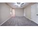 Relaxing bedroom with neutral walls, carpet, ceiling fan, and closet space at 5810 Tree Line Ter, Lithonia, GA 30058