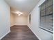 This bedroom features new wood flooring, ceiling fan, and a bright window at 5810 Tree Line Ter, Lithonia, GA 30058