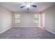 Comfortable bedroom with neutral walls, carpet, and ample natural light at 5810 Tree Line Ter, Lithonia, GA 30058
