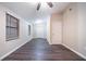Large bedroom offers carpet flooring, a ceiling fan, and two bright windows with blinds at 5810 Tree Line Ter, Lithonia, GA 30058