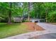Charming home with a well-maintained front yard, covered parking, and mature trees at 5810 Tree Line Ter, Lithonia, GA 30058