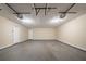Wide angle view of 2-car garage featuring two overhead doors and concrete flooring at 5810 Tree Line Ter, Lithonia, GA 30058