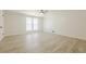 Spacious bedroom filled with natural light and featuring vinyl plank flooring at 9985 Lake Forest Way, Roswell, GA 30076