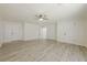 Spacious bedroom featuring vinyl plank flooring, lots of natural light, and neutral paint at 9985 Lake Forest Way, Roswell, GA 30076