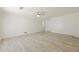 Empty bedroom showcasing luxury vinyl plank flooring, a ceiling fan and lots of natural light at 9985 Lake Forest Way, Roswell, GA 30076