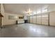 Spacious two-car garage with ample storage, cabinets, and a durable, sealed concrete floor at 9985 Lake Forest Way, Roswell, GA 30076