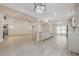 Open concept living room and kitchen with high ceilings and luxury vinyl plank flooring at 9985 Lake Forest Way, Roswell, GA 30076