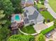Aerial view of the property with a swimming pool, outdoor seating area, and landscaped yard at 110 Keswick Way, Alpharetta, GA 30022