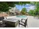 Home exterior featuring a pool, an outdoor bar and comfortable patio seating at 110 Keswick Way, Alpharetta, GA 30022