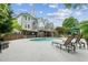 Backyard featuring pool, lounge chairs, an outdoor bar and lush landscaping at 110 Keswick Way, Alpharetta, GA 30022