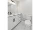 Contemporary bathroom featuring white cabinets, marble countertops, and sleek fixtures throughout at 110 Keswick Way, Alpharetta, GA 30022