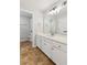 Bathroom featuring white cabinetry, stone tile flooring and great natural light at 110 Keswick Way, Alpharetta, GA 30022