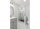 Modern bathroom featuring a glass shower, grey vanity, and marble floors at 110 Keswick Way, Alpharetta, GA 30022