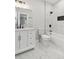 Bright bathroom with marble flooring, a tub, and a modern vanity for a serene bathing experience at 110 Keswick Way, Alpharetta, GA 30022