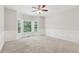 Inviting bedroom with plush carpeting, large windows, and detailed trim for a serene living space at 110 Keswick Way, Alpharetta, GA 30022