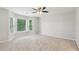 Bright bedroom with bay windows and neutral carpeting at 110 Keswick Way, Alpharetta, GA 30022