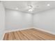 Bright bedroom features ceiling fan, recessed lights and wood flooring at 110 Keswick Way, Alpharetta, GA 30022