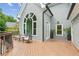 Beautiful outdoor deck with seating and an arched window at 110 Keswick Way, Alpharetta, GA 30022