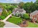 Stunning two-story home boasts a well-manicured lawn and beautiful landscaping at 110 Keswick Way, Alpharetta, GA 30022