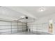 Spacious garage with epoxy flooring and shelving at 110 Keswick Way, Alpharetta, GA 30022