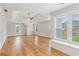 Spacious living room with tray ceiling, hardwood floors and plenty of natural light at 110 Keswick Way, Alpharetta, GA 30022