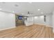 Entertainment room includes a wet bar, hardwood floors, recessed lighting, and ceiling fan at 110 Keswick Way, Alpharetta, GA 30022