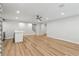 Relaxing entertainment room features a wet bar, hardwood floors, recessed lighting, and ceiling fan at 110 Keswick Way, Alpharetta, GA 30022