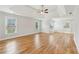 Spacious main bedroom boasts hardwood floors, tray ceilings, and abundant natural light from multiple windows at 110 Keswick Way, Alpharetta, GA 30022