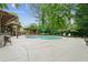Backyard pool with stone bar and landscaped outdoor spaces at 110 Keswick Way, Alpharetta, GA 30022