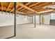 Unfinished basement with concrete floor and exposed ceiling with support beams at 2813 Hillside Rd, Smyrna, GA 30080