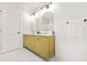 Elegant bathroom with a dual sink vanity, marble countertop, and modern fixtures at 2813 Hillside Rd, Smyrna, GA 30080