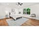 Bright bedroom with a large window, neutral decor, ceiling fan and hardwood flooring at 2813 Hillside Rd, Smyrna, GA 30080