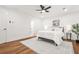 A relaxing bedroom with soft lighting, a ceiling fan, and an inviting queen-sized bed at 2813 Hillside Rd, Smyrna, GA 30080