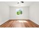 Bright bedroom with hardwood flooring and a large window at 2813 Hillside Rd, Smyrna, GA 30080
