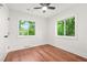 Well-lit bedroom with two windows offering views of the outdoors and complemented by hardwood flooring at 2813 Hillside Rd, Smyrna, GA 30080