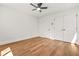 Bedroom features a ceiling fan, hardwood floors, and a double-door closet at 2813 Hillside Rd, Smyrna, GA 30080