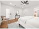 Cozy bedroom with queen bed, modern decor, bright lighting and a back patio door at 2813 Hillside Rd, Smyrna, GA 30080