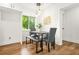 Cozy dining area featuring modern table and bench set next to a bright window at 2813 Hillside Rd, Smyrna, GA 30080