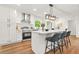 Stylish kitchen with white cabinets, stainless steel appliances, and a marble countertop island at 2813 Hillside Rd, Smyrna, GA 30080